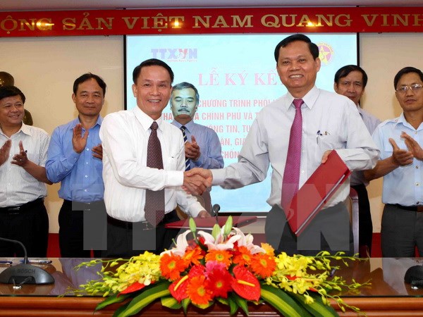 Tổng Thanh tra Chính phủ Huỳnh Phong Tranh và Tổng Giám đốc Thông tấn xã Việt Nam Nguyễn Đức Lợi 